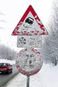 A snowy road signs skidding in winter | Stock image | Colourbox