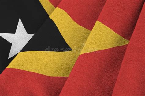 Timor Leste Flag with Big Folds Waving Close Up Under the Studio Light Indoors. the Official ...