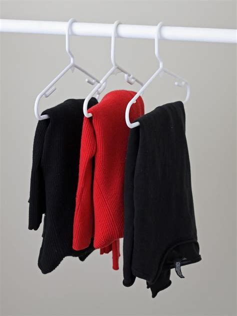 Hang lightweight sweaters folded over small plastic hangers to avoid ...