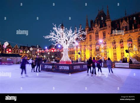 Christmas Ice skating rink in the Bruges Market Square Stock Photo - Alamy