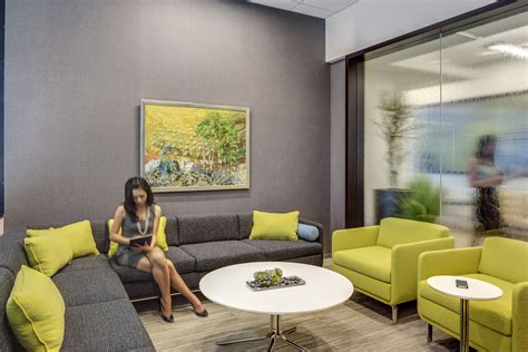 a woman sitting on top of a couch in a living room