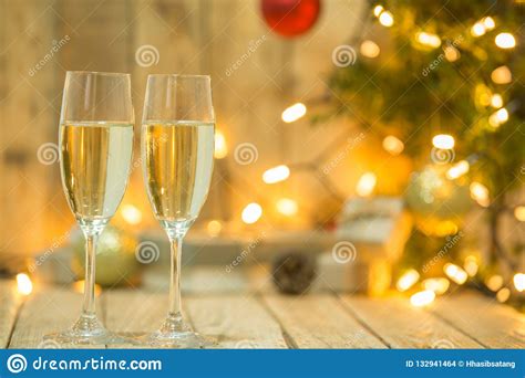 Wine Glasses in Front of a Christmas Tree Stock Photo - Image of dinner, holiday: 132941464