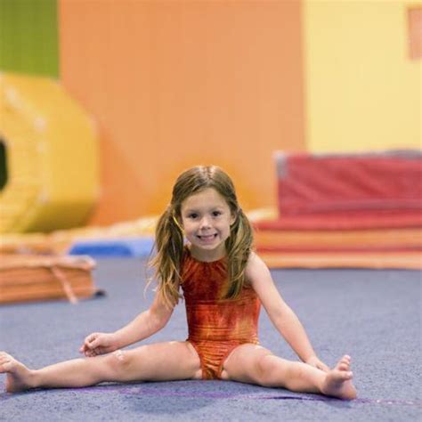 Young girl stretching during a gymnastics class. Gymnastics Games, Gymnastics Warm Ups ...