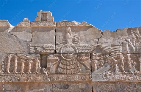 Ahura Mazda - relief of winged sun symbol of Zoroastrianism in ruined Persepolis Stock Photo ...