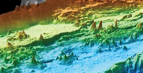 Hundreds of towering hydrothermal chimneys belching superheated liquid warmed by volcanic magma ...