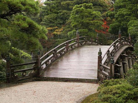 Ancient Japanese stone bridge in Imperial park; Kyoto, Japan - Stock Photo - Dissolve