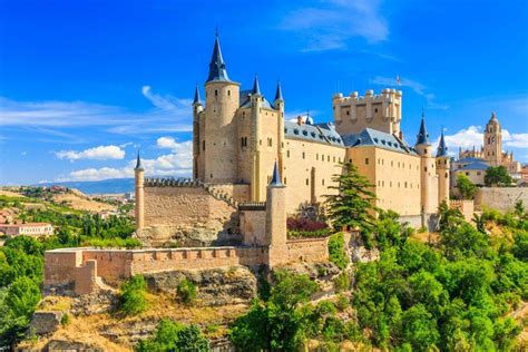 The Alcazar, a castle-palace, lies in the walled city of Segovia in the ...