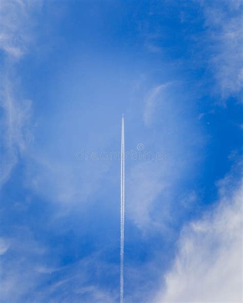 Jet in Sky with Vapor Trail Vertical Stock Photo - Image of motion, atmosphere: 122081124