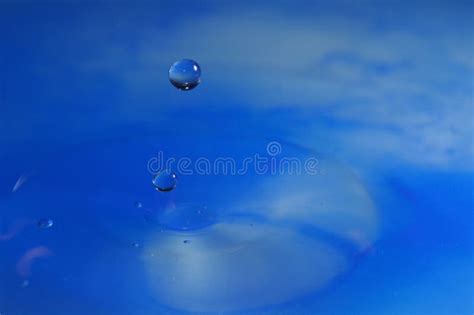 Macro Shot of Water Drop Falling in Blue Water Stock Photo - Image of ...