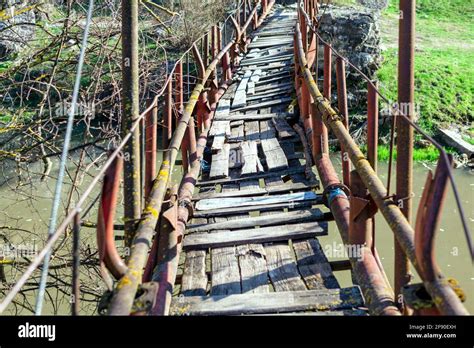 Rickety bridge for pedestrian passing across the river . Trekking with adventure Stock Photo - Alamy