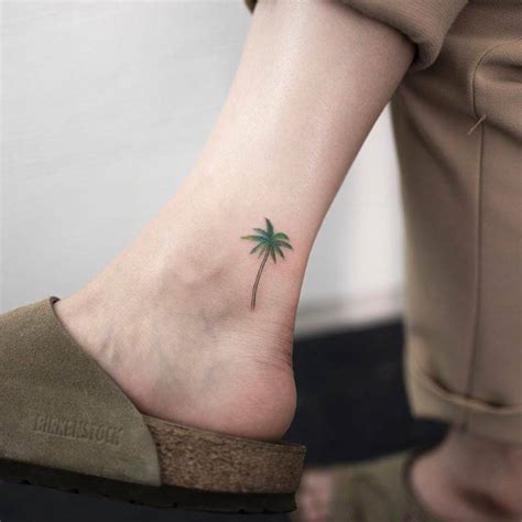 Subtle palm tree tattoo on the ankle - Tattoogrid.net