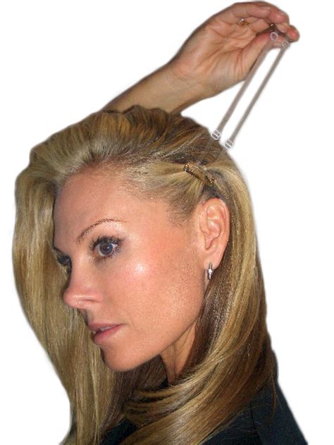 The instant facelift band clips to both sides of your head and uses ...