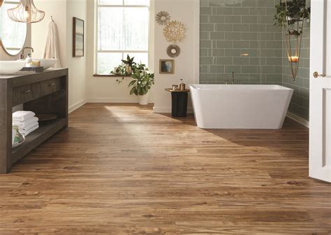 These durable luxury vinyl flooring planks are waterproof (great for bathrooms, kitchens, and ...