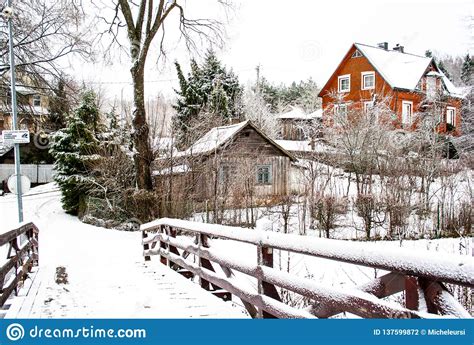 Wooden Bridge in Winter, Trees and and Wooden Houses Covered by Snow ...