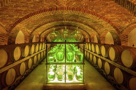 Old Wine Cellar With Barrels And Bottles Photograph by Seppfriedhuber - Fine Art America