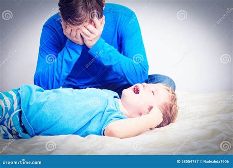 Crying Child, Tired Father Stock Photo - Image: 58554737