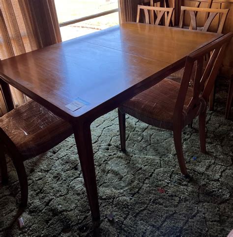 Wooden dining table with 8 chairs | EstateSales.org