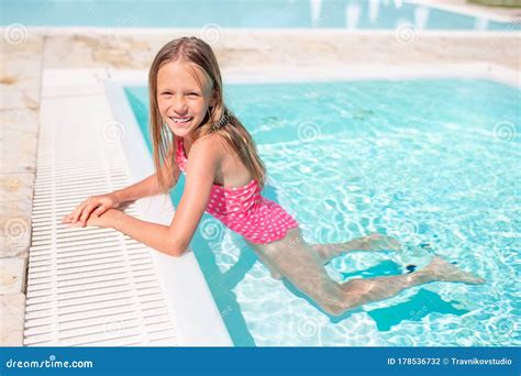 Adorable Little Girl Swimming at Outdoor Swimming Pool Stock Photo - Image of lifestyle, child ...