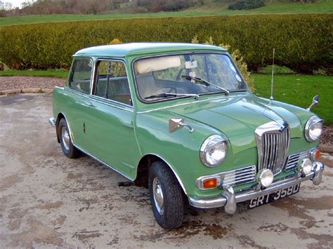 Riley Elf, British Motors Corp. parked by a hedge. Porcelain green ...