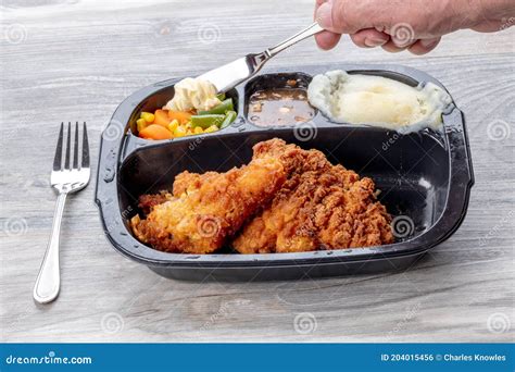 Fried Chicken Dinner and Butter on a Knife Stock Photo - Image of meal, desert: 204015456