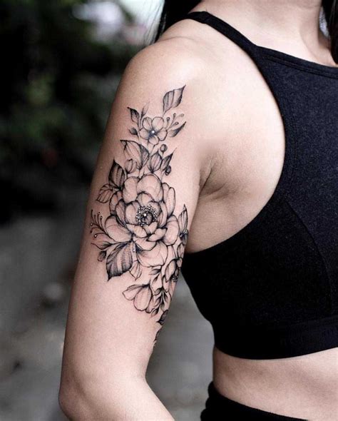 A black floral piece on the right upper arm | Tattoos for women half sleeve, Unique half sleeve ...