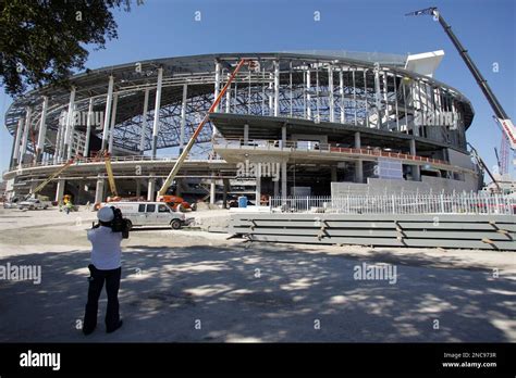 A cameraman takes video of the Florida Marlins new ballpark in MIami ...