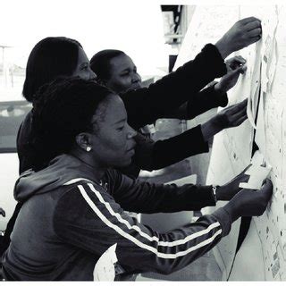 Community health workers and registrar doctor drawing on a map ...