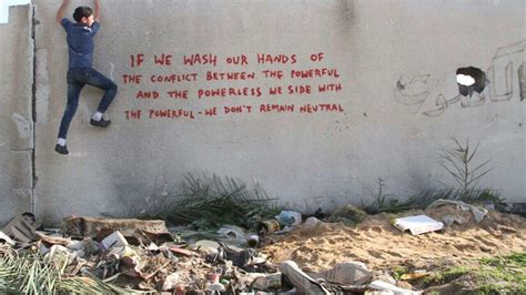 Street artist Banksy uses Gaza as canvas to highlight plight of ...