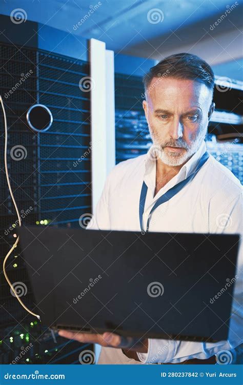 Lets See What the Cause is for this Issue. a Mature Man Using a Laptop while Working in a Server ...