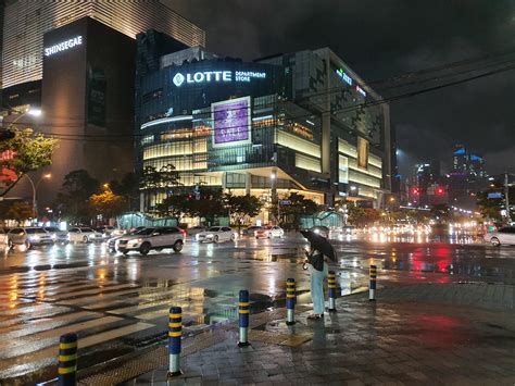 City lights and rainy night, BEXCO in Busan, South Korea. : r/raining