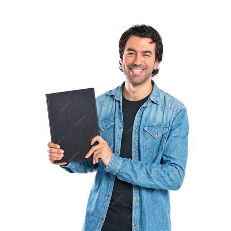 Free Photo | Man holding a book over white background