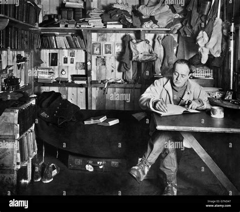 Captain Robert Falcon Scott writing in his diary in his hut at Cape ...