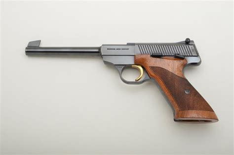 Belgian-made Browning semi-auto pistol, .22LR cal., 6-3/4” barrel, blue finish, checkered wood grips