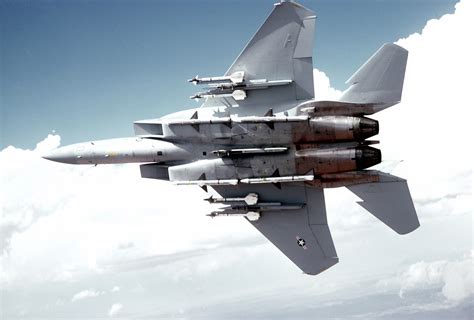 Bottom view of an F-15 Eagle aircraft armed with AIM-9 Sidewinder and AIM-7 Sparrow missiles, in ...