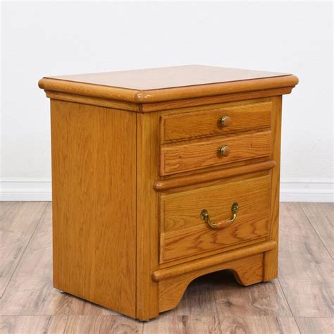 This "Lexington" nightstand is featured in a solid wood with a glossy ...