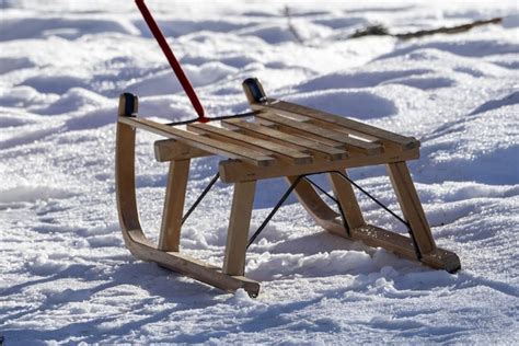 Premium Photo | Wooden sledge on the snow