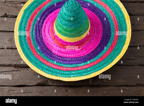 Mexican sombrero on old dark wood background Stock Photo - Alamy