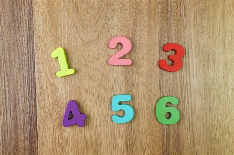 Premium Photo | Numbers one two three four five and six on the wooden background