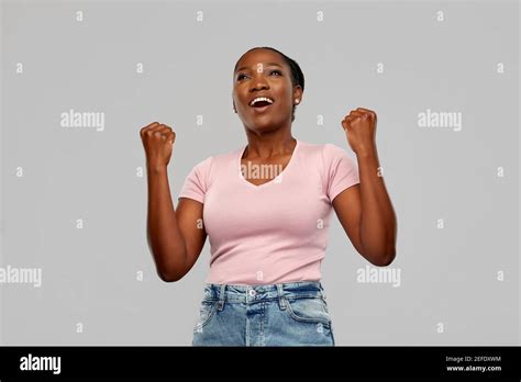 happy african american woman celebrating success Stock Photo - Alamy