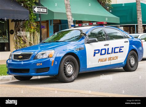 Florida Worth Avenue luxury shopping street road Palm Beach Police force car blue Chevrolet ...