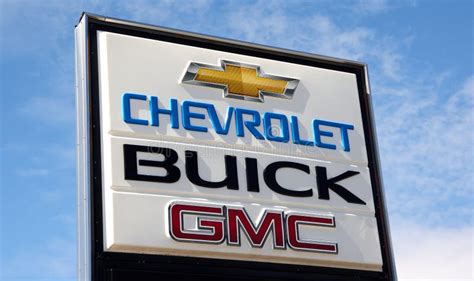 Chevrolet Buick and GMC Sign at Dealership Over a Blue Sky Editorial ...