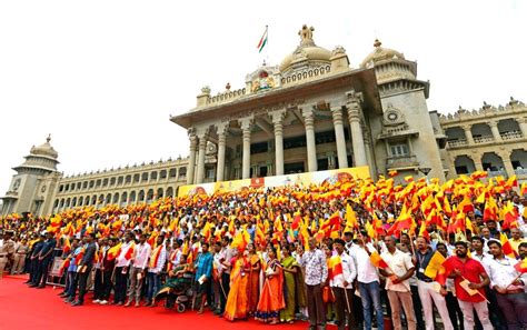 People holding Kannada flags and sing classic Kannada songs