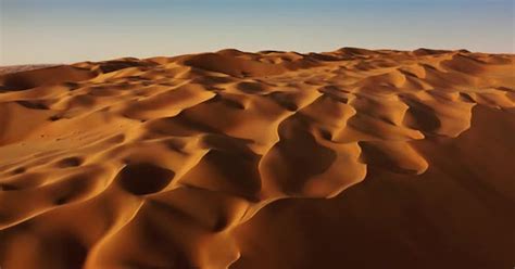 Sand dunes in Arabian desert aerial view. Liwa, Abu Dhabi, United Arab Emirates by aerostocklab ...