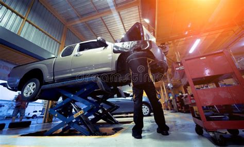 Car on Hydraulic Lift in Auto Repair Shop Stock Photo - Image of maintenance, vehicle: 271106688