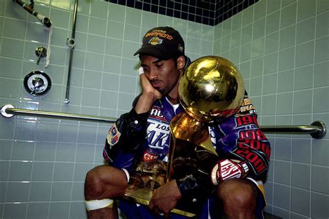 PHILADELPHIA - JUNE 15: Kobe Bryant #8 of the Los Angeles Lakers poses with the NBA Championship ...