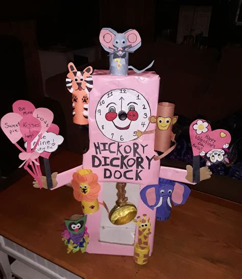 Hickory dickory dock clock. Made from shoeboxes and toliet paper rolls. Clock face opens up to ...