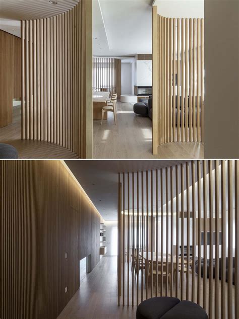 Oak Slat Walls Divide The Spaces Inside This Apartment's Interior