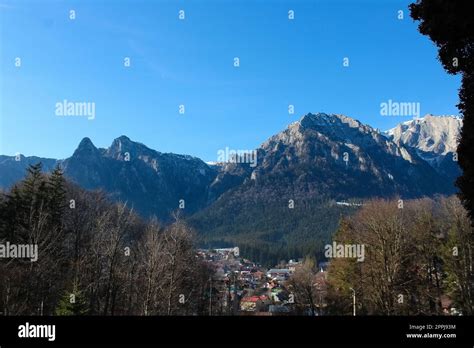 Sunny winter landscape with Bucegi mountains and Busteni ski resort in Romania Stock Photo - Alamy