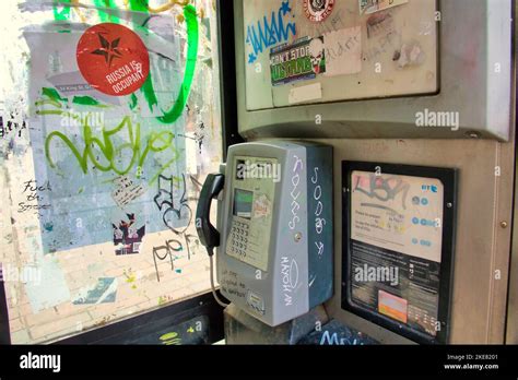 graffiti vandalised phone booth Stock Photo - Alamy