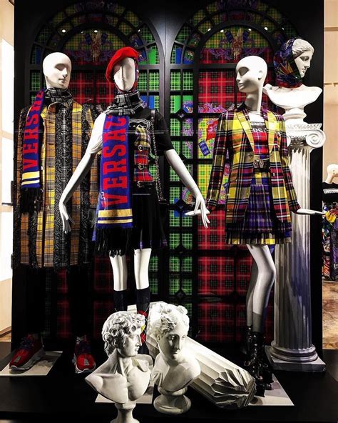 White Male and Female Egghead Abstract Display Mannequins wearing plaid ...